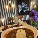 The Bayou Kitchen & Lounge company logo